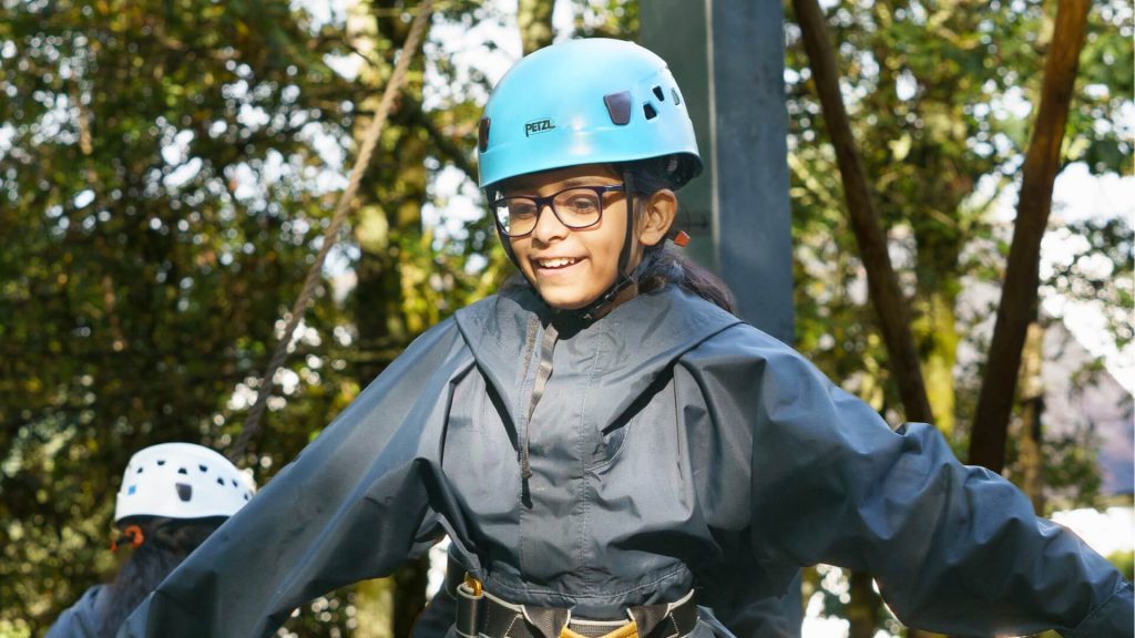 Child on an outdoor ropes course