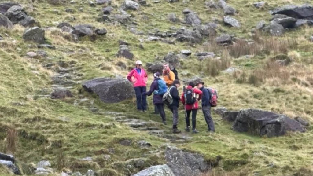 Group of walkers map reading