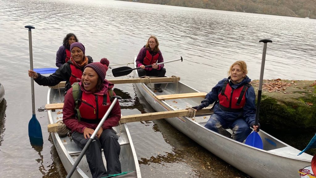 Group kayaking at Ghyll Head Challenge Weekend